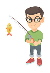 Image showing Little boy holding fishing rod with fish on hook.