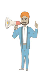Image showing Hindu businessman talking into loudspeaker.