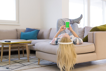 Image showing girl enjoying music through headphones