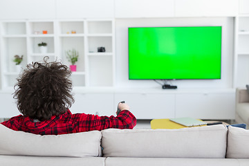 Image showing young man in bathrobe enjoying free time