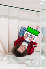 Image showing freelancer in bathrobe working from home