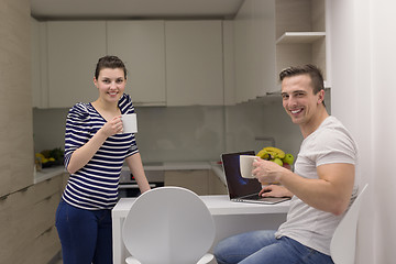 Image showing couple with laptop computer enjoying morning