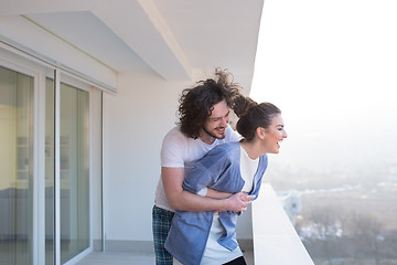 Image showing Couple hugging on the balcony