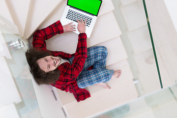 Image showing freelancer in bathrobe working from home