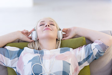 Image showing girl enjoying music through headphones