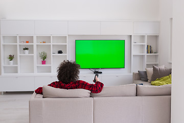 Image showing young man in bathrobe enjoying free time