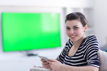 Image showing woman on sofa using tablet computer