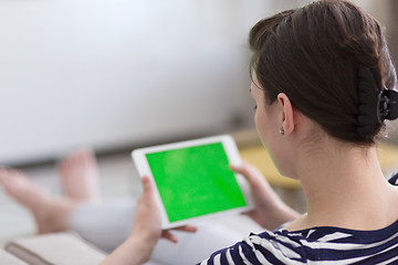 Image showing woman on sofa using tablet computer