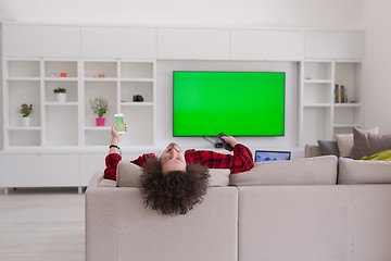 Image showing young man in bathrobe enjoying free time