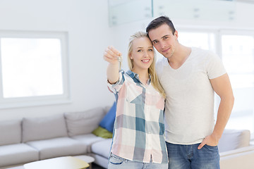 Image showing couple showing a keys of their new house