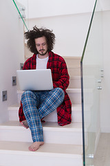 Image showing freelancer in bathrobe working from home