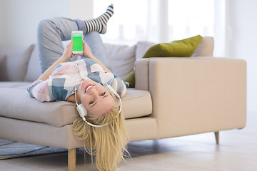 Image showing girl enjoying music through headphones