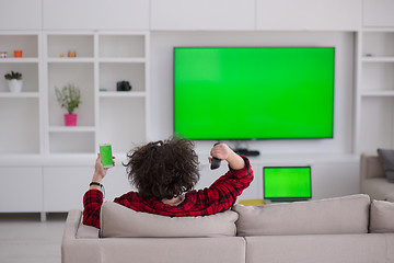 Image showing young man in bathrobe enjoying free time