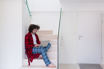 Image showing freelancer in bathrobe working from home