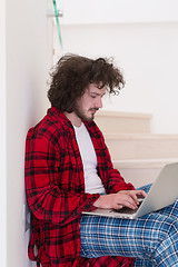 Image showing freelancer in bathrobe working from home