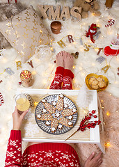 Image showing Christmas food among Christmas decorations in cosy home