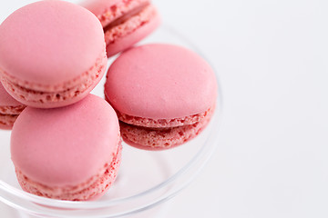 Image showing close up of pink macarons on confectionery stand