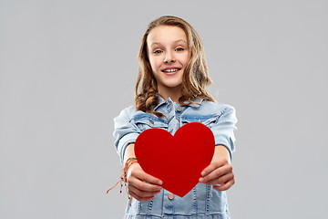 Image showing smiling teenage girl with red heart