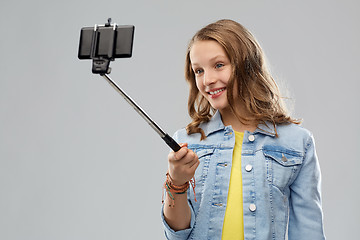 Image showing teenage girl taking selfie by smartphone