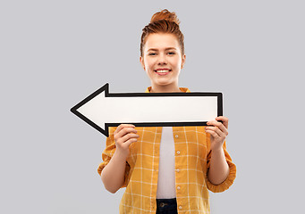 Image showing red haired teenage girl with arrow showing to left