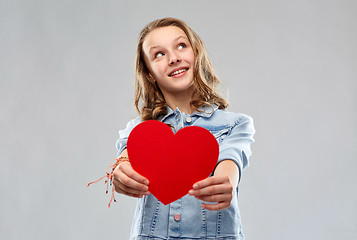 Image showing smiling teenage girl with red heart