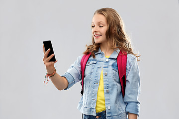 Image showing teenage student girl taking selfie by smartphone