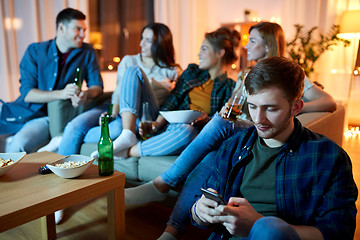 Image showing man with smartphone at home party