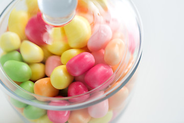 Image showing close up of glass jar with colorful candy drops