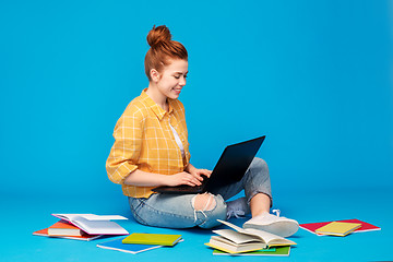 Image showing red haired teenage student girl with laptop