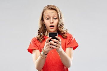 Image showing terrified teenage girl using smartphone