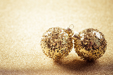 Image showing Golden christmas balls on glitter background with copy space