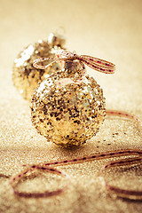 Image showing Golden christmas balls on glitter background with copy space