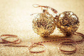 Image showing Golden christmas balls on glitter background with copy space