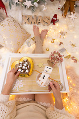 Image showing Enjoying hot cocoa and festive gingerbread at Christmas time