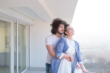 Image showing Couple hugging on the balcony