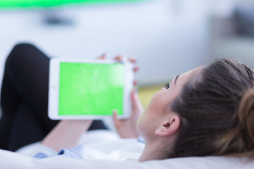 Image showing woman on sofa using tablet computer