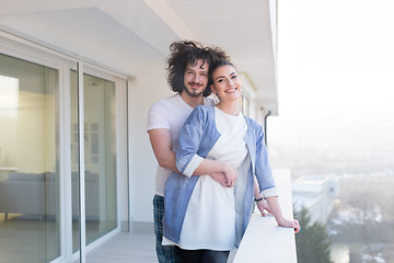 Image showing Couple hugging on the balcony