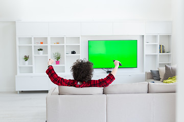 Image showing young man in bathrobe enjoying free time