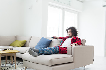 Image showing young man in bathrobe enjoying free time