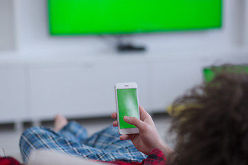 Image showing young man in bathrobe enjoying free time