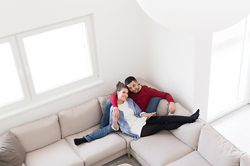 Image showing couple relaxing at  home with tablet computers