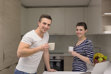 Image showing couple with laptop computer enjoying morning