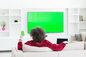 Image showing young man in bathrobe enjoying free time