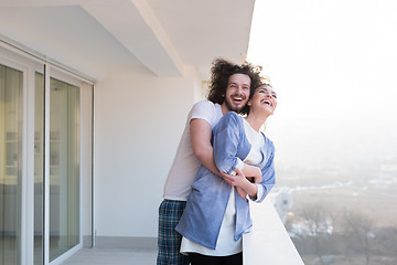 Image showing Couple hugging on the balcony