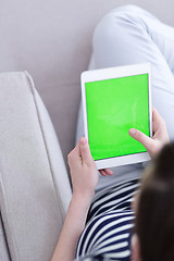 Image showing woman on sofa using tablet computer