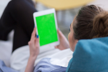 Image showing woman on sofa using tablet computer