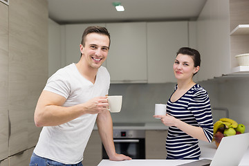 Image showing couple with laptop computer enjoying morning