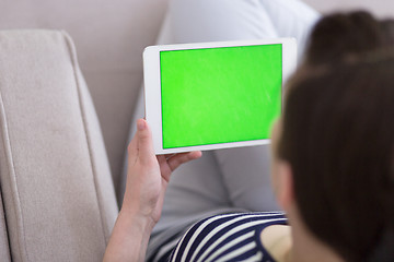 Image showing woman on sofa using tablet computer