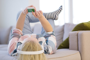 Image showing girl enjoying music through headphones