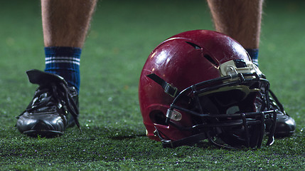 Image showing closeup of american football player and helmet